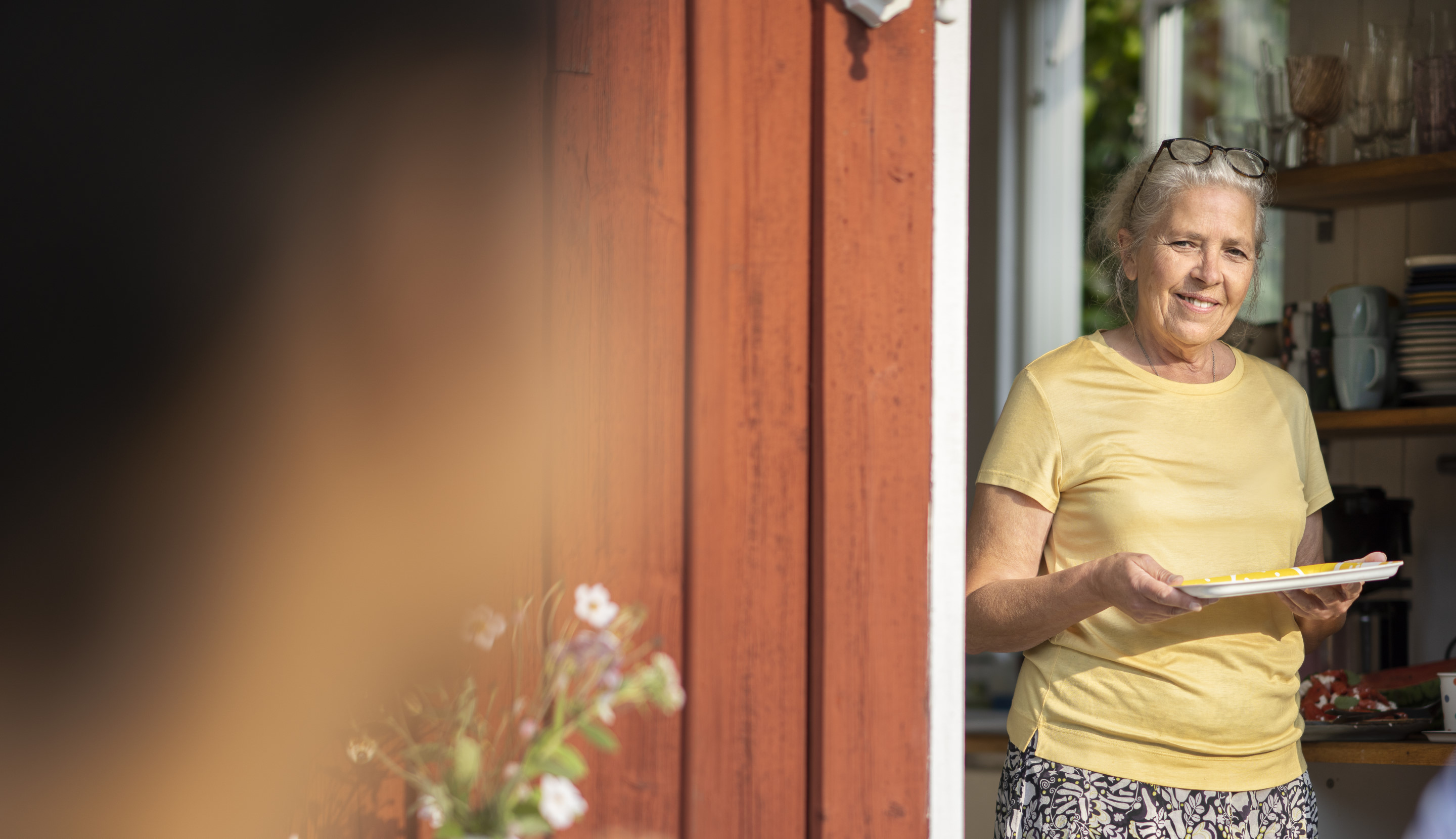 Woman exiting a house.